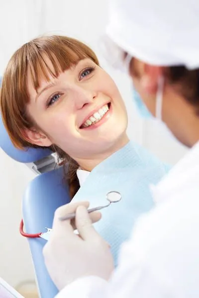 woman smiling in the dental chair during her visit to Afdent in Fort Wayne, IN