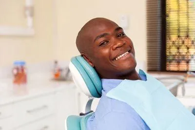 man smiling in the dental chair during his visit to Afdent in Fort Wayne, IN